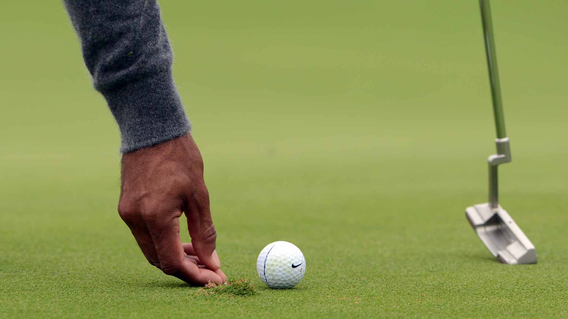 Is it a penalty if your unrepaired ball mark helps you hole your putt?